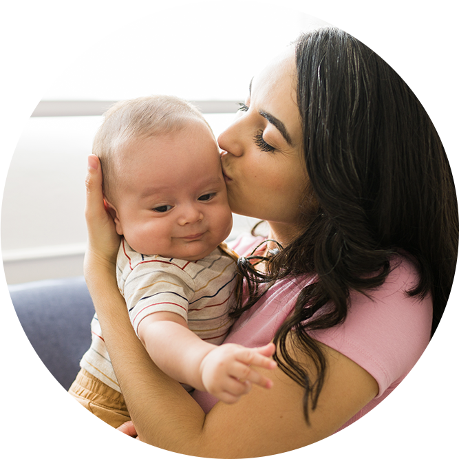 Woman kissing baby