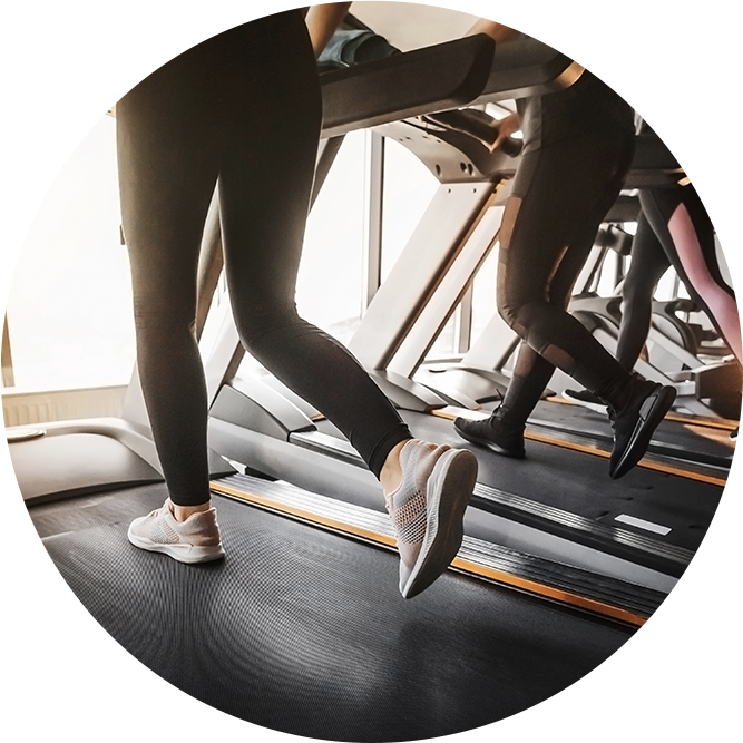 people running on treadmills in gym